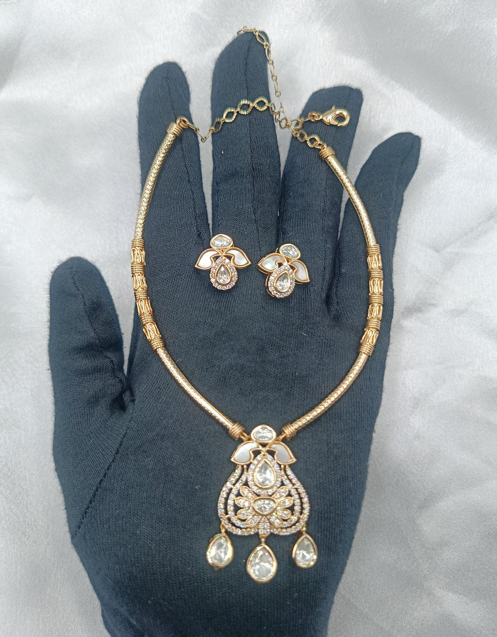 Punita Brass Gold Plated Kundan Moissanite Hasli Necklace with Earring