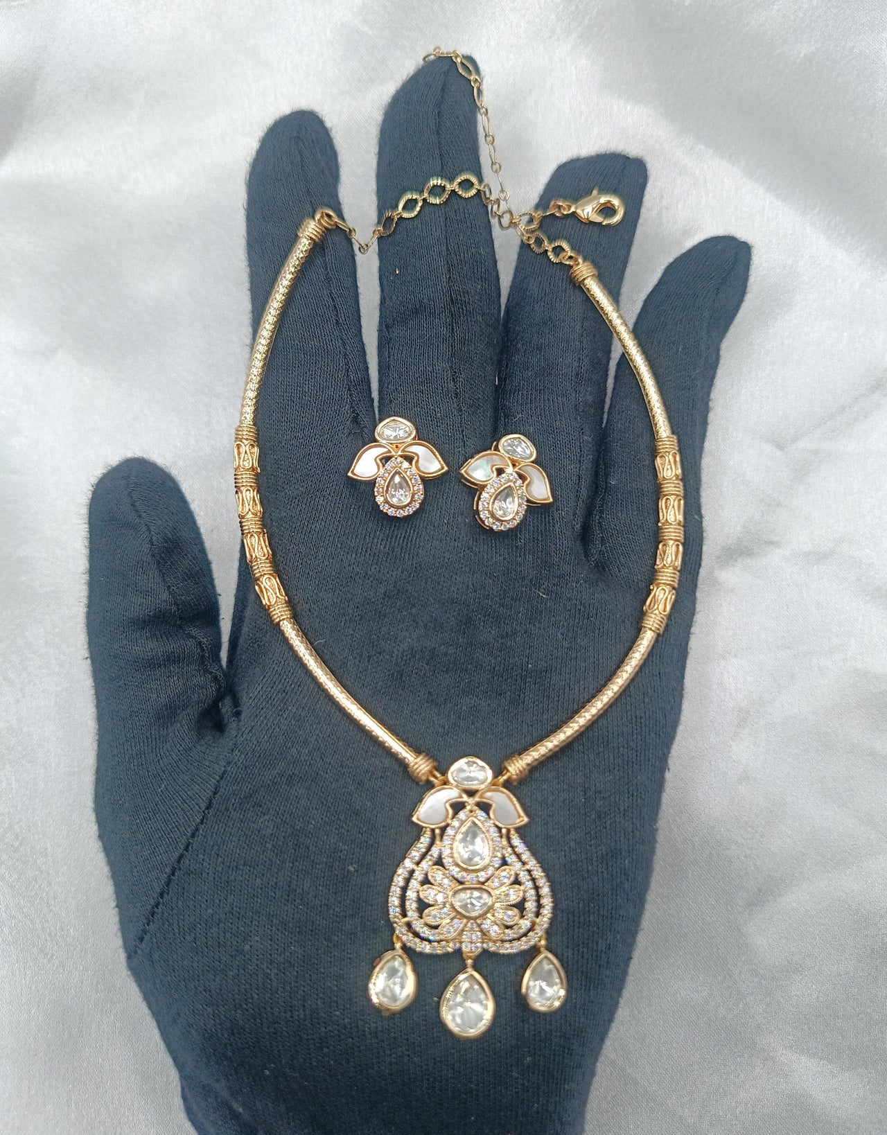 Punita Brass Gold Plated Kundan Moissanite Hasli Necklace with Earring
