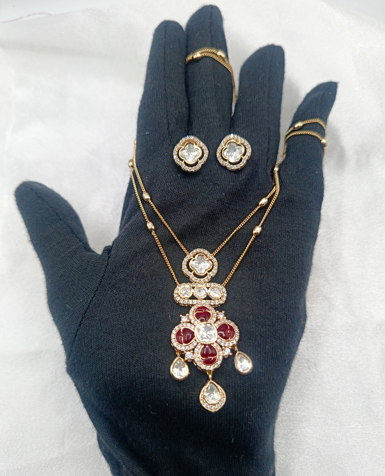Avantika Ruby Epoxy Brass Gold Plated Double Chain Kundan Moissanite Pendant Set