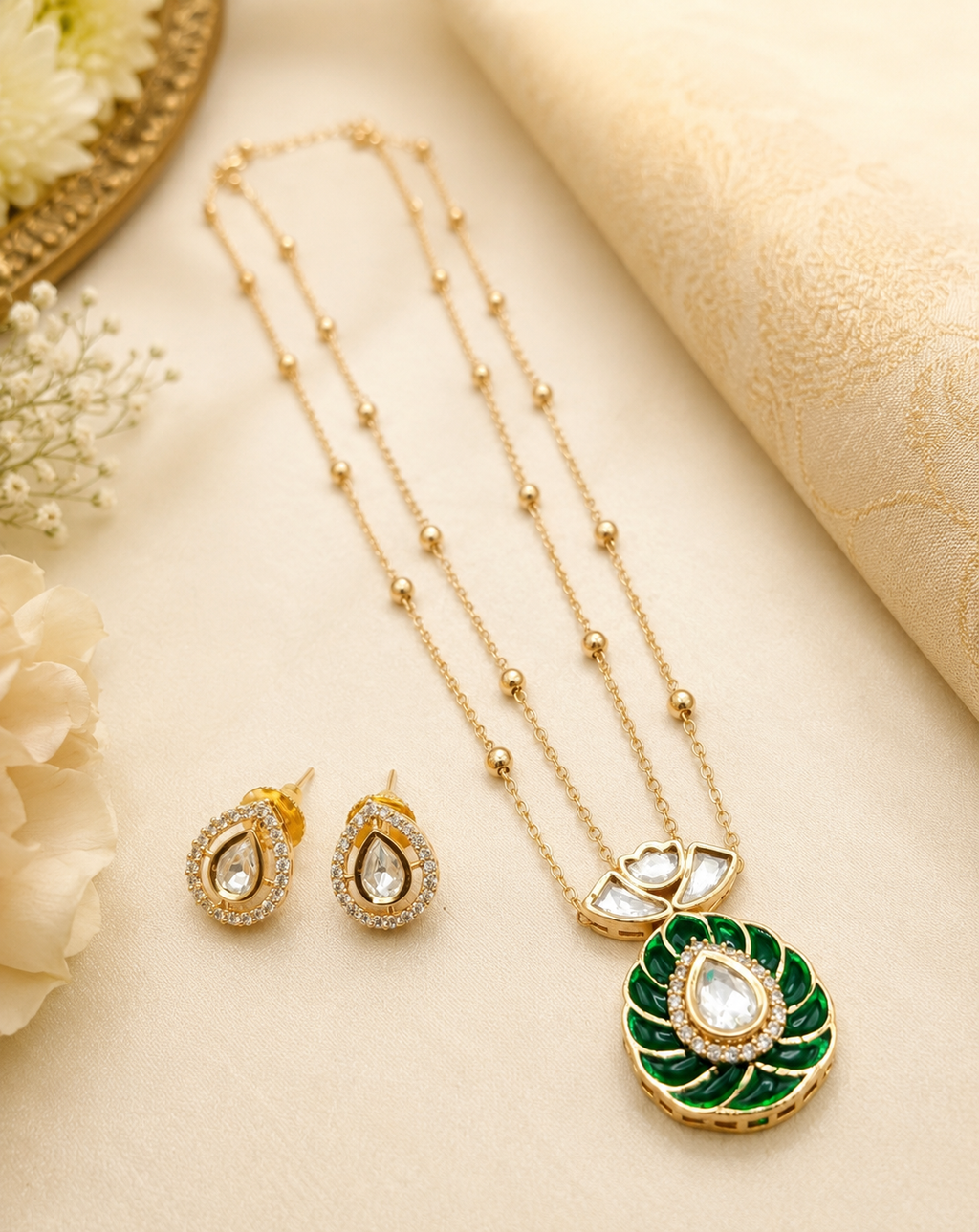 Alisha Emerald Brass Gold Plated Kundan Moissanite Double Chain Pendant Set